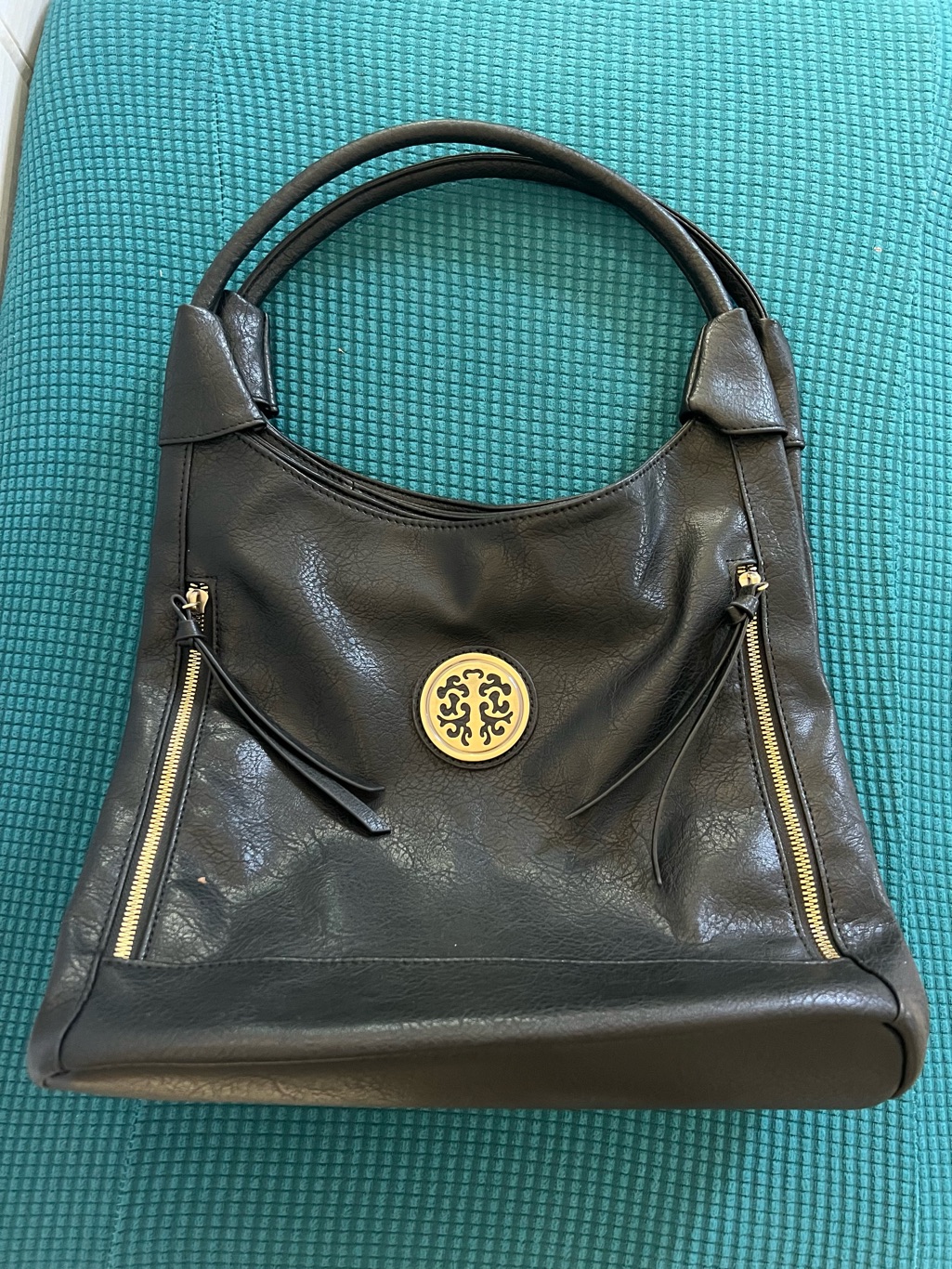 Elegant Black Vegan Leather Shoulder Bag With Gold Emblem